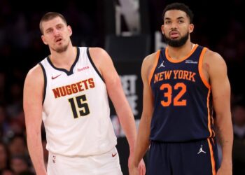 Jan 29, 2025; New York, New York, USA; Denver Nuggets center Nikola Jokic (15) and New York Knicks center Karl-Anthony Towns (32) react during the fourth quarter at Madison Square Garden.