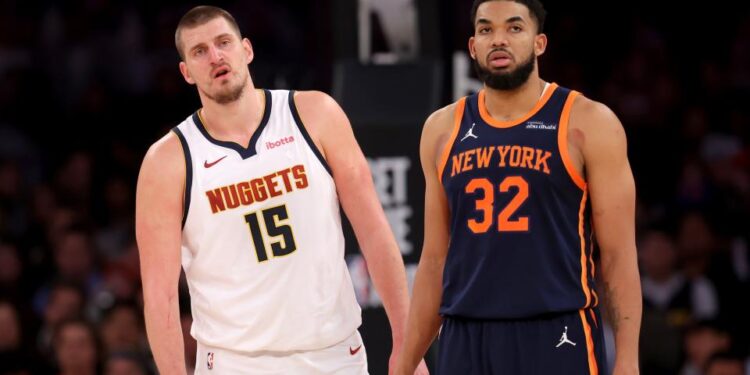 Jan 29, 2025; New York, New York, USA; Denver Nuggets center Nikola Jokic (15) and New York Knicks center Karl-Anthony Towns (32) react during the fourth quarter at Madison Square Garden.