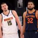 Jan 29, 2025; New York, New York, USA; Denver Nuggets center Nikola Jokic (15) and New York Knicks center Karl-Anthony Towns (32) react during the fourth quarter at Madison Square Garden.