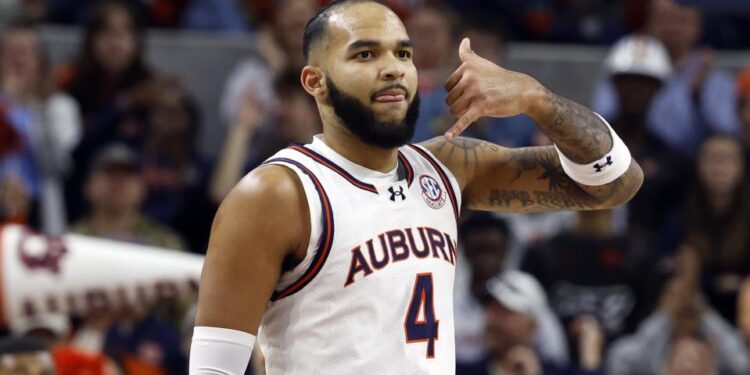 Auburn forward Johni Broome reacts after making a 3-point basket against Missouri during the first half of an NCAA college basketball game, Saturday, Jan. 4, 2025, in Auburn, Ala. (AP Photo/Butch Dill)