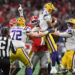 ATLANTA, GA - DECEMBER 03: Georgia Bulldogs Defensive Linemen Jalen Carter (88) holds LSU Tigers Quarterback Jayden Daniels (5) in the air during the SEC Championship game between the LSU Tigers and the Georgia Bulldogs on December 03, 2022, at Mercedes-Benz Stadium in Atlanta, GA. (Photo by Jeffrey Vest/Icon Sportswire via Getty Images)