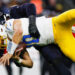 HOUSTON, TEXAS - JANUARY 11: Denico Autry #96 of the Houston Texans sacks Justin Herbert #10 of the Los Angeles Chargers in the third quarter during the AFC Wild Card Playoff game at NRG Stadium on January 11, 2025 in Houston, Texas. (Photo by Brandon Sloter/Getty Images)