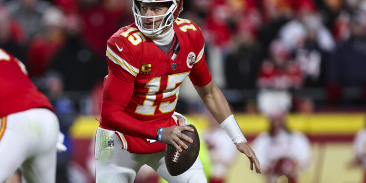 KANSAS CITY, MISSOURI - JANUARY 18: Patrick Mahomes #15 of the Kansas City Chiefs scrambles out of the pocket during an NFL football AFC divisional playoff game against the Houston Texans at GEHA Field at Arrowhead Stadium on January 18, 2025 in Kansas City, Missouri.  (Photo by Perry Knotts/Getty Images)