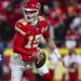 KANSAS CITY, MISSOURI - JANUARY 18: Patrick Mahomes #15 of the Kansas City Chiefs scrambles out of the pocket during an NFL football AFC divisional playoff game against the Houston Texans at GEHA Field at Arrowhead Stadium on January 18, 2025 in Kansas City, Missouri.  (Photo by Perry Knotts/Getty Images)