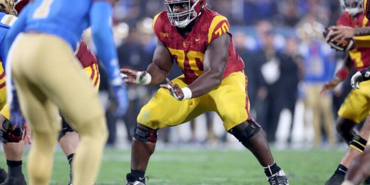 PASADENA, CALIFORNIA - NOVEMBER 23: Emmanuel Pregnon #70 of the USC Trojans.