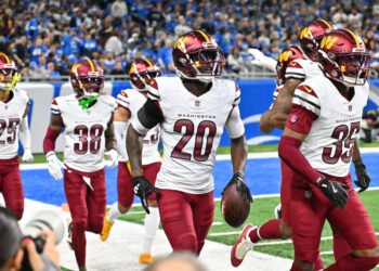 Washington's defense celebrates one of its five takeaways against the Lions. (Steven King/Icon Sportswire via Getty Images)