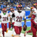 Washington's defense celebrates one of its five takeaways against the Lions. (Steven King/Icon Sportswire via Getty Images)