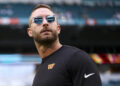 MIAMI GARDENS, FL - AUGUST 17: Offensive coordinator Kliff Kingsbury of the Washington Commanders looks on prior to an NFL preseason football game against the Miami Dolphins at Hard Rock Stadium on August 17, 2024 in Miami Gardens, FL. (Photo by Kevin Sabitus/Getty Images)