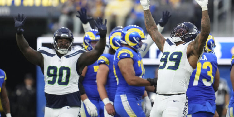 Seattle Seahawks defensive end Leonard Williams (99) celebrates after sacking Los Angeles Rams quarterback Jimmy Garoppolo during the second half of an NFL football game Sunday, Jan. 5, 2025, in Inglewood, Calif. (AP Photo/Eric Thayer)