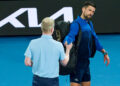 MELBOURNE, AUSTRALIA - JANUARY 19: Novak Djokovic of Serbia hands the microphone back to Jim Courier after speaking to the crowd following victory against Jiri Lehecka of the Czech Republic in the Men's Singles Fourth Round match during day eight of the 2025 Australian Open at Melbourne Park on January 19, 2025 in Melbourne, Australia. (Photo by Andy Cheung/Getty Images)