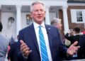 Tommy Tuberville talks during a television interview before former President Donald Trump speaks at Trump National Golf Club in Bedminster