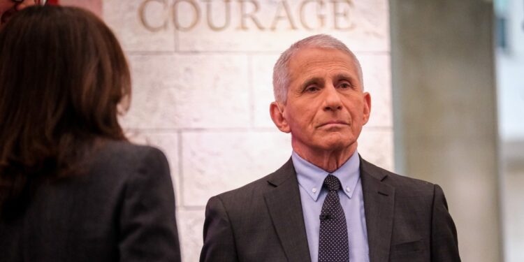 Dr. Anthony Fauci stands