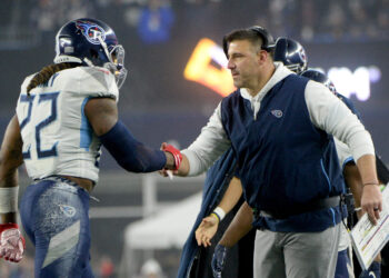 Derrick Henry of the Tennessee Titans celebrates his touchdown with head coach Mike Vrabel against the New England Patriots in the second quarter of the AFC Wild Card Playoff game at Gillette Stadium on January 04, 2020 in Foxborough, Massachusetts.