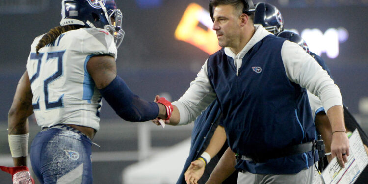 Derrick Henry of the Tennessee Titans celebrates his touchdown with head coach Mike Vrabel against the New England Patriots in the second quarter of the AFC Wild Card Playoff game at Gillette Stadium on January 04, 2020 in Foxborough, Massachusetts.