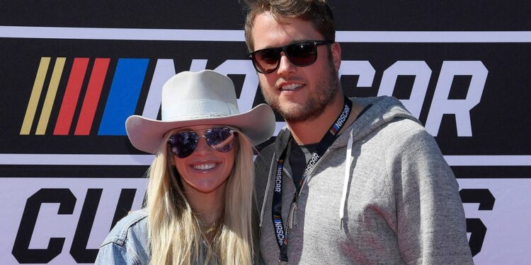 Kelly and Matthew Stafford at a NASCAR race