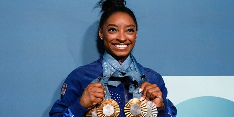 Simone Biles with her medals