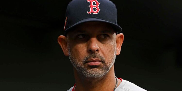 Boston Red Sox manager Alex Cora looks on from dugout