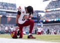 Jayden Daniels prays before game