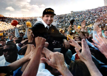 University of Colorado Head Football Coach Bill McCartney is carried off the field after a win against Nebraska in the 1989 season.(Photo by Cliff Grassmick/Digital First Media/Boulder Daily Camera via Getty Images)