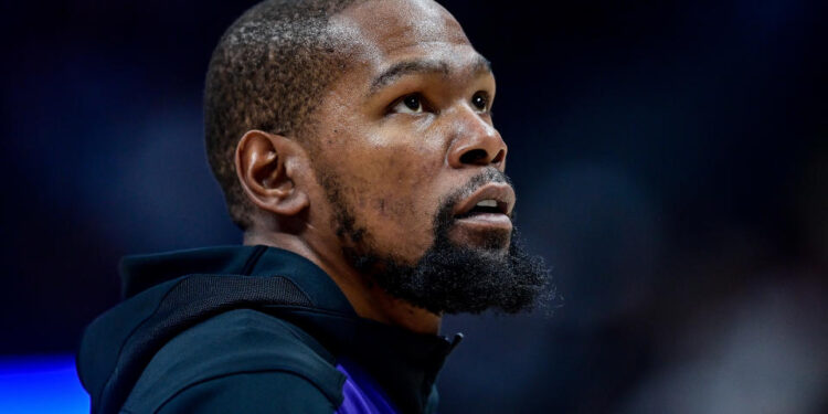 DENVER, COLORADO - DECEMBER 23: Kevin Durant #35 of the Phoenix Suns looks on before a game against the Denver Nuggets at Ball Arena on December 23, 2024, 2024 in Denver, Colorado. NOTE TO USER: User expressly acknowledges and agrees that, by downloading and or using this photograph, User is consenting to the terms and conditions of the Getty Images License Agreement. (Photo by Dustin Bradford/Getty Images)