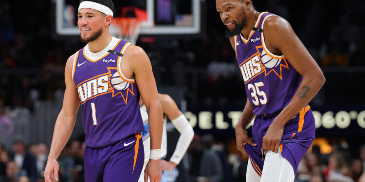 Are the Suns stockpiling assets to upgrade their roster this season around Devin Booker and Kevin Durant? (Photo by Kevin C. Cox/Getty Images)