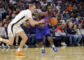 Jan 15, 2025; Charlottesville, Virginia, USA; Southern Methodist Mustangs guard Boopie Miller (2) dribbles the ball as Virginia Cavaliers guard Andrew Rohde (4) defends during the first half at John Paul Jones Arena. Mandatory Credit: Amber Searls-Imagn Images