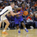 Jan 15, 2025; Charlottesville, Virginia, USA; Southern Methodist Mustangs guard Boopie Miller (2) dribbles the ball as Virginia Cavaliers guard Andrew Rohde (4) defends during the first half at John Paul Jones Arena. Mandatory Credit: Amber Searls-Imagn Images