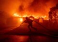 Firefighter battles a fire