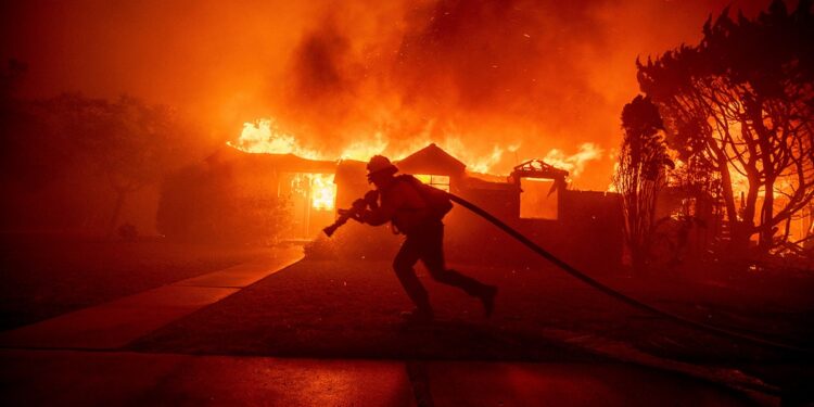 Firefighter battles a fire