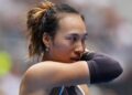 Zheng Qinwen reacts to a point during the Australian Open