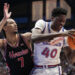 LAWRENCE, KANSAS - JANUARY 25: Flory Bidunga #40 of the Kansas Jayhawks drives to the basket as he is defended by Milos Uzan #7 of the Houston Cougars in the first half at Allen Fieldhouse on January 25, 2025 in Lawrence, Kansas. (Photo by Ed Zurga/Getty Images)