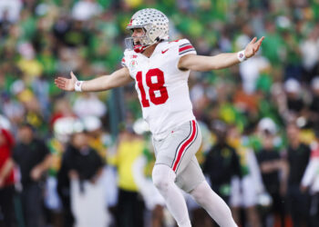 PASADENA, CALIFORNIA - JANUARY 1: Will Howard #18 of the Ohio State Buckeyes celebrates a touchdown in the first half during the Rose Bowl against Oregon Ducks at Rose Bowl Stadium on January 1, 2025 in Pasadena, California. (Photo by Ric Tapia/Getty Images)