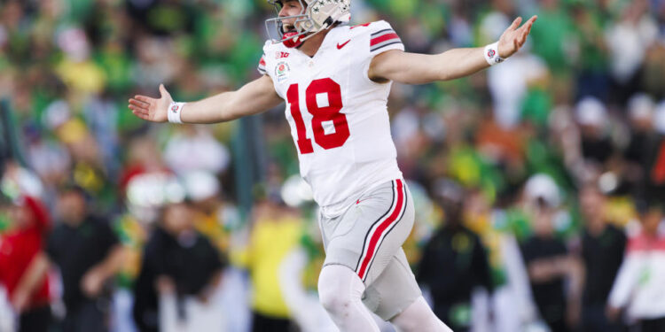 PASADENA, CALIFORNIA - JANUARY 1: Will Howard #18 of the Ohio State Buckeyes celebrates a touchdown in the first half during the Rose Bowl against Oregon Ducks at Rose Bowl Stadium on January 1, 2025 in Pasadena, California. (Photo by Ric Tapia/Getty Images)