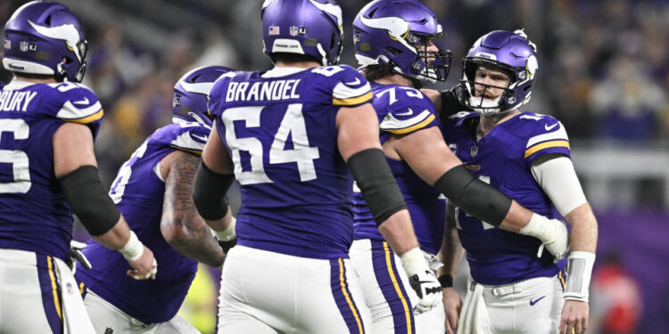 MINNEAPOLIS, MINNESOTA - DECEMBER 29: Quarterback Sam Darnold #14 of the Minnesota Vikings celebrates with Brian O'Neill #75 after a throwing a touchdown pass during the third quarter against the Green Bay Packers at U.S. Bank Stadium on December 29, 2024 in Minneapolis, Minnesota. (Photo by Stephen Maturen/Getty Images)