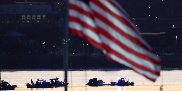 Rescuers work on the Potomac River in Washington DC after a tragic plane crash