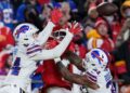 Xavier Worthy jumps for the ball