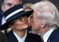 US President-elect Donald Trump kisses Melania Trump as he arrives for the inauguration ceremony