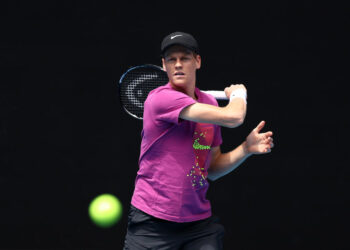 MELBOURNE, AUSTRALIA - JANUARY 05: Jannik Sinner of Italy 
 plays a forehand during a practice session ahead of the 2025 Australian Open at Melbourne Park on January 05, 2025 in Melbourne, Australia. (Photo by Graham Denholm/Getty Images)