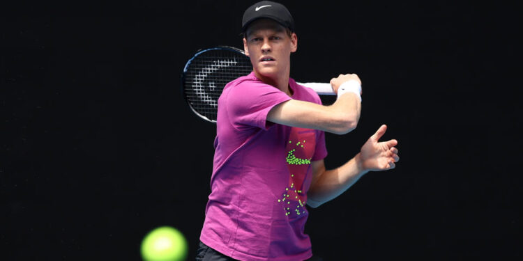 MELBOURNE, AUSTRALIA - JANUARY 05: Jannik Sinner of Italy 
 plays a forehand during a practice session ahead of the 2025 Australian Open at Melbourne Park on January 05, 2025 in Melbourne, Australia. (Photo by Graham Denholm/Getty Images)