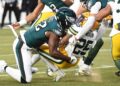 Packers players gets tackled