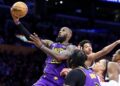 Los Angeles, California January 21, 2025-Lakers LeBron James drives to the basket to score against the Wizards in the second quarter at Crypto.com Arena Tuesday. (Wally Skalij/Los Angeles Times)