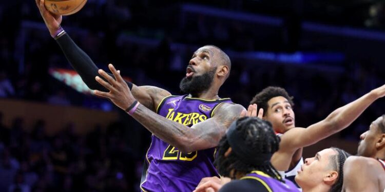 Los Angeles, California January 21, 2025-Lakers LeBron James drives to the basket to score against the Wizards in the second quarter at Crypto.com Arena Tuesday. (Wally Skalij/Los Angeles Times)