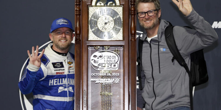 MARTINSVILLE, VIRGINIA - OCTOBER 28: Justin Allgaier, driver of the #7 Hellmann's Chevrolet, (L) and NASCAR Hall of Famer and JR Motorsports owner, Dale Earnhardt Jr. celebrate in victory lane after winning the NASCAR Xfinity Series Dead On Tools 250 at Martinsville Speedway on October 28, 2023 in Martinsville, Virginia. (Photo by Chris Graythen/Getty Images)