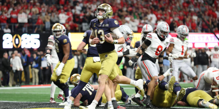 ATLANTA, GEORGIA - JANUARY 20: Riley Leonard #13 of the Notre Dame Fighting Irish scores a first quarter touchdown against the Ohio State Buckeyes during the 2025 CFP National Championship at the Mercedes-Benz Stadium on January 20, 2025 in Atlanta, Georgia. (Photo by Jamie Squire/Getty Images)