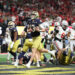 ATLANTA, GEORGIA - JANUARY 20: Riley Leonard #13 of the Notre Dame Fighting Irish scores a first quarter touchdown against the Ohio State Buckeyes during the 2025 CFP National Championship at the Mercedes-Benz Stadium on January 20, 2025 in Atlanta, Georgia. (Photo by Jamie Squire/Getty Images)