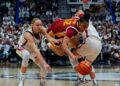 JuJu Watkins, center, is defended by Paige Bueckers and Kaitlyn Chen during the second half of an NCAA women's basketball game at the XL Center on Dec. 21, 2024 in Hartford, Connecticut.