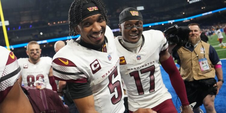 Jayden Daniels #5 of the Washington Commanders celebrates with Terry McLaurin #17 after defeating the Detroit Lions 45-31 in the NFC Divisional Playoff at Ford Field on January 18, 2025 in Detroit, Michigan.  