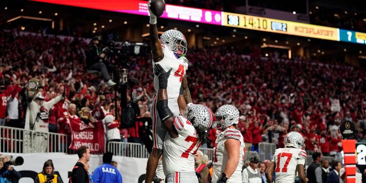 Jeremiah Smith lifted after scoring touchdown