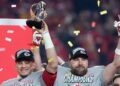 Patrick Mahomes holds the trophy