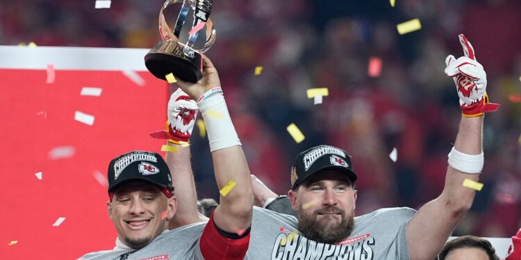 Patrick Mahomes holds the trophy